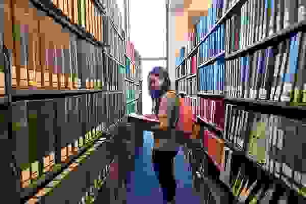 student in library